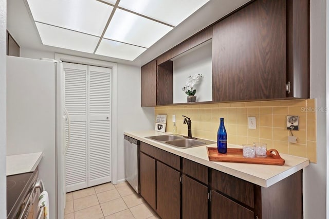 206 Diamond Cv Unit 106, Casselberry, FL 32707 - kitchen featuring a sink, appliances with stainless steel finishes, dark brown cabinetry, and tasteful backsplash