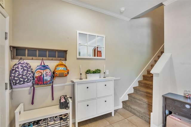 interior space with crown molding and tile patterned floors