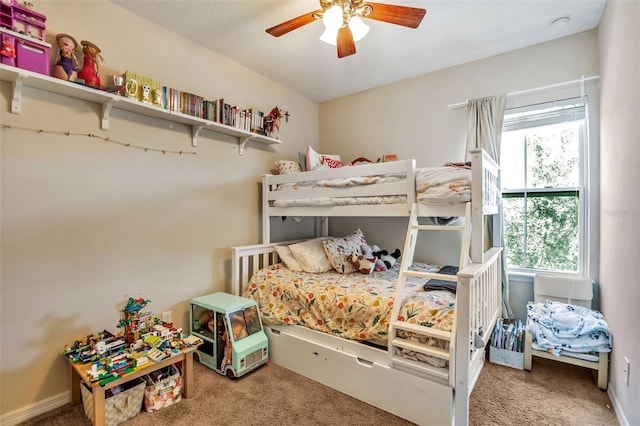 carpeted bedroom featuring a ceiling fan