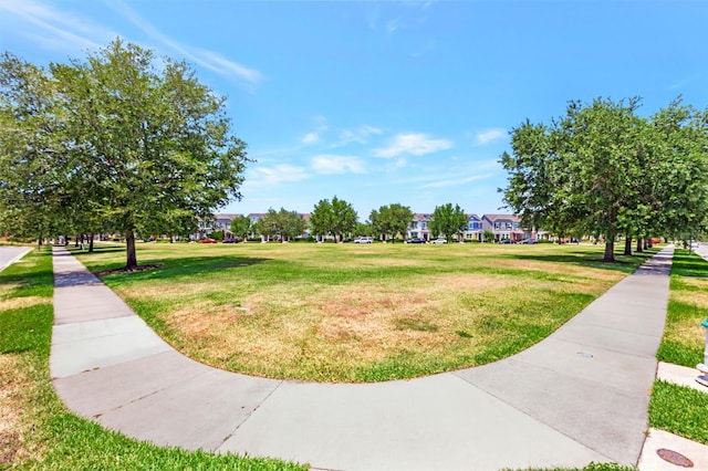 view of home's community with a lawn