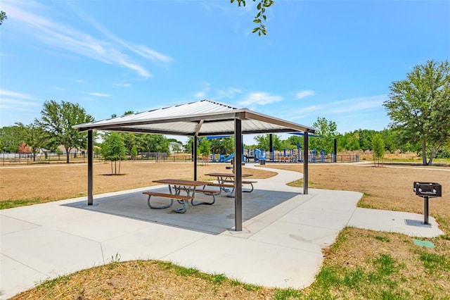 surrounding community with fence, a gazebo, a yard, and playground community