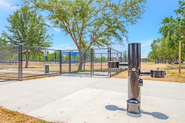 view of home's community featuring a gate and fence