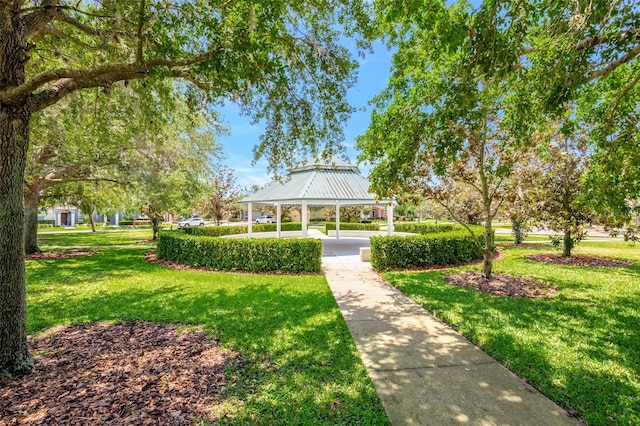 view of home's community with a gazebo and a lawn