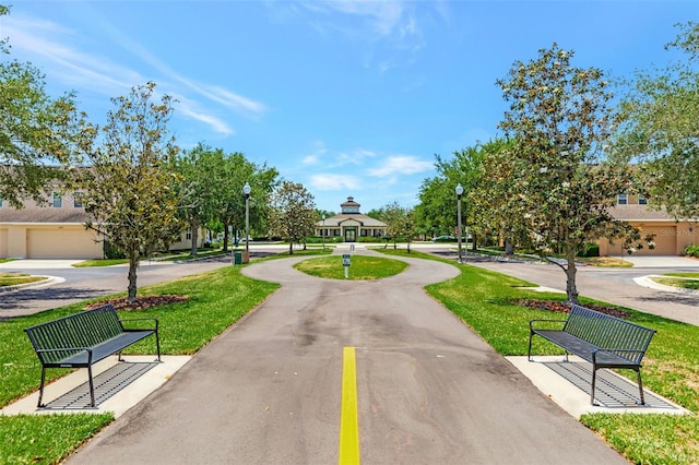 view of home's community featuring a lawn