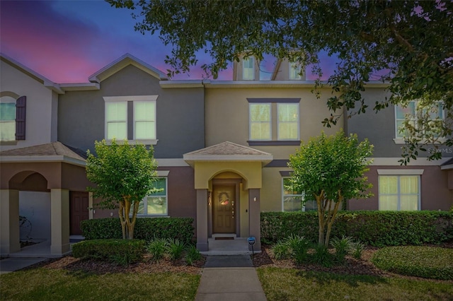 view of front of house featuring stucco siding