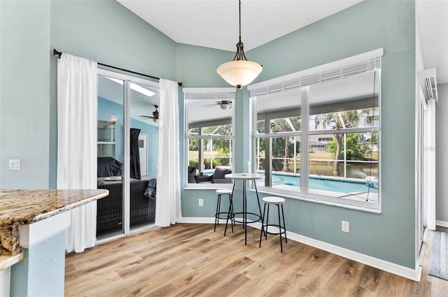 633 Lakehaven Cir, Orlando, FL 32828 - dining room with ceiling fan, wood finished floors, and baseboards
