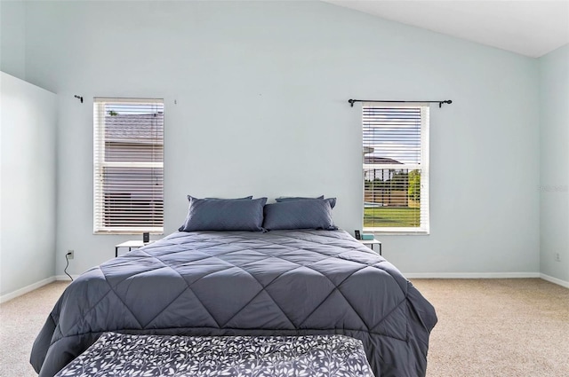 633 Lakehaven Cir, Orlando, FL 32828 - carpeted bedroom with baseboards and lofted ceiling