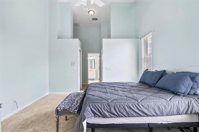 633 Lakehaven Cir, Orlando, FL 32828 - carpeted bedroom featuring a high ceiling and baseboards