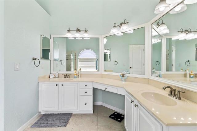 633 Lakehaven Cir, Orlando, FL 32828 - full bath with tile patterned floors, double vanity, and baseboards