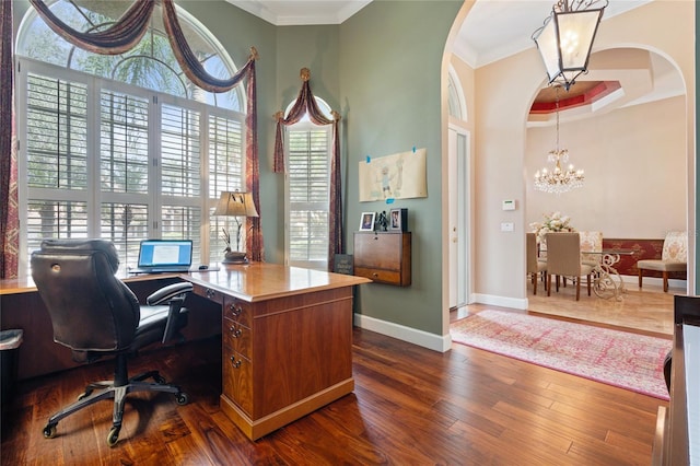 2232 Lake Vilma Dr, Orlando, FL 32835 - office space featuring crown molding, dark wood-style flooring, arched walkways, a chandelier, and baseboards