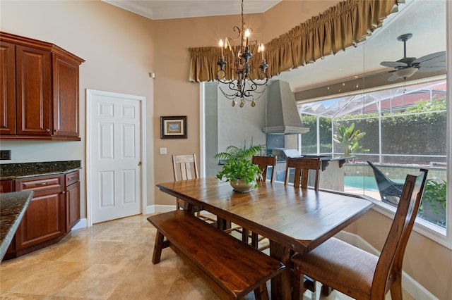 2232 Lake Vilma Dr, Orlando, FL 32835 - dining area featuring baseboards, ceiling fan with notable chandelier, a towering ceiling, and a wealth of natural light