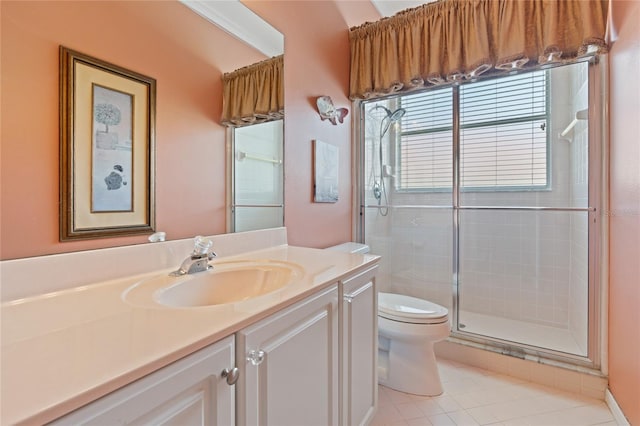 2232 Lake Vilma Dr, Orlando, FL 32835 - bathroom with vanity, tile patterned flooring, a stall shower, and toilet