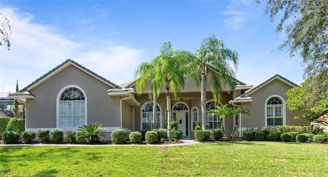 2232 Lake Vilma Dr, Orlando, FL 32835 - view of front of property with stucco siding and a front yard