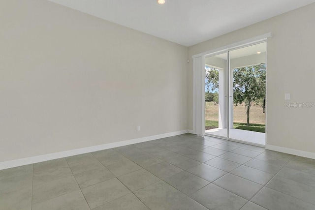 unfurnished room with baseboards, recessed lighting, and tile patterned flooring