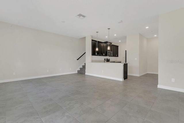 unfurnished living room featuring recessed lighting, baseboards, light tile patterned floors, visible vents, and stairway