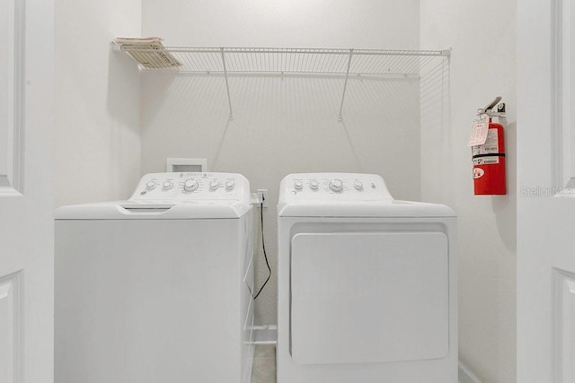 laundry area with laundry area and washing machine and clothes dryer
