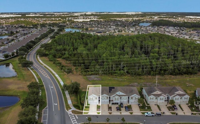 aerial view with a water view and a residential view
