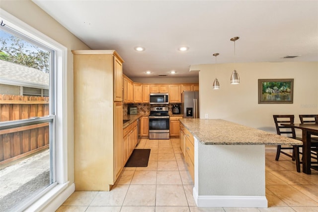 2260 Winslow Cir, Casselberry, FL 32707 - kitchen featuring backsplash, appliances with stainless steel finishes, light tile patterned floors, and visible vents