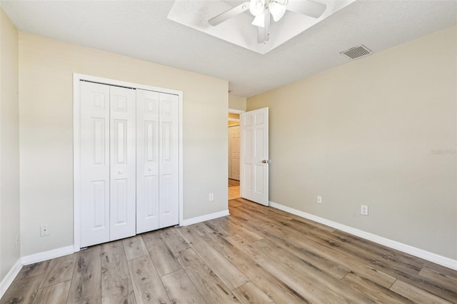 2260 Winslow Cir, Casselberry, FL 32707 - unfurnished bedroom with ceiling fan, baseboards, wood finished floors, visible vents, and a closet