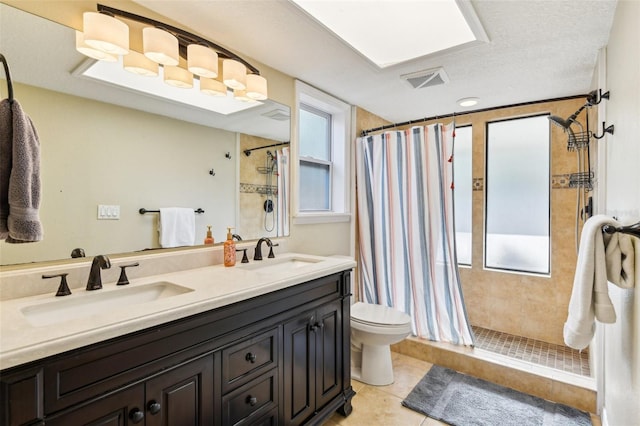 2260 Winslow Cir, Casselberry, FL 32707 - bathroom with a sink, tile patterned floors, and a tile shower