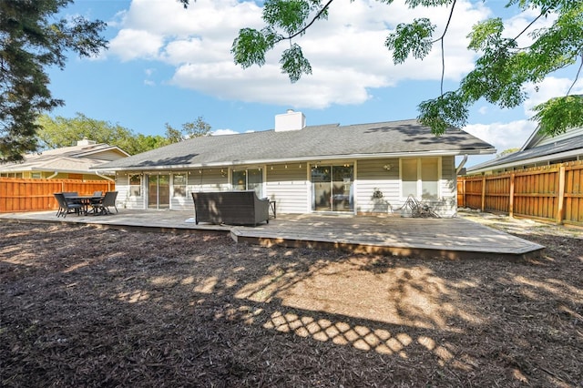 2260 Winslow Cir, Casselberry, FL 32707 - rear view of house with a deck, a chimney, a fenced backyard, and outdoor dining area