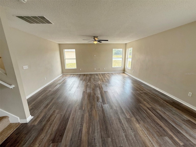 786 Crystal Bay Ln, Orlando, FL 32828 - unfurnished room featuring visible vents, dark wood-style flooring, stairway, a textured ceiling, and a ceiling fan