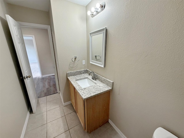 786 Crystal Bay Ln, Orlando, FL 32828 - bathroom with vanity, baseboards, tile patterned flooring, and toilet