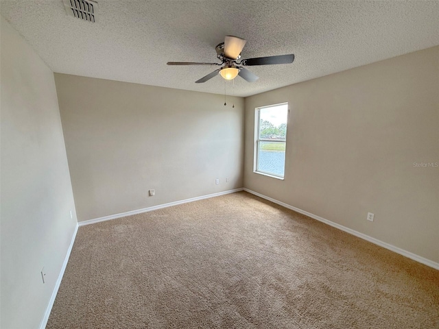 786 Crystal Bay Ln, Orlando, FL 32828 - carpeted empty room with visible vents, a ceiling fan, baseboards, and a textured ceiling