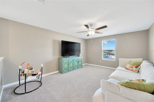 living area with a ceiling fan, baseboards, visible vents, and carpet