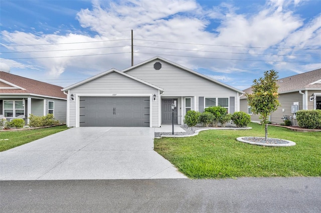 1397 Gatlin Pl, The Villages, FL 32163 - single story home featuring an attached garage, driveway, and a front yard