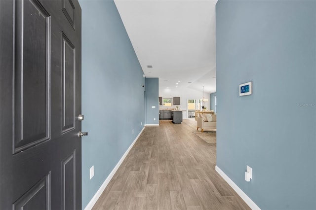 1397 Gatlin Pl, The Villages, FL 32163 - corridor featuring baseboards and light wood-type flooring