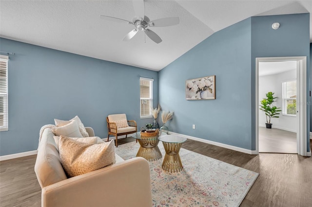 1397 Gatlin Pl, The Villages, FL 32163 - living area with a healthy amount of sunlight, a ceiling fan, wood finished floors, and lofted ceiling
