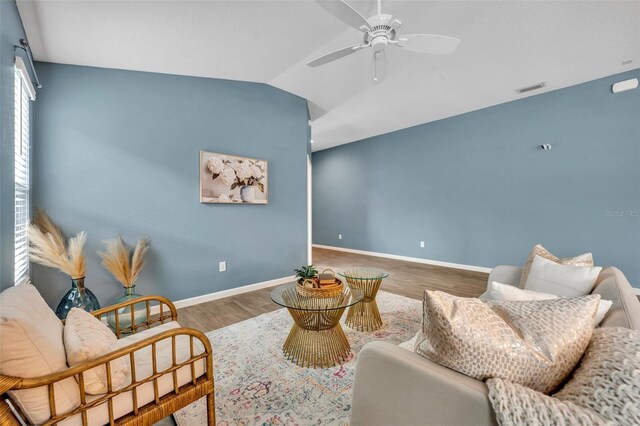 1397 Gatlin Pl, The Villages, FL 32163 - living room with a ceiling fan, visible vents, wood finished floors, baseboards, and lofted ceiling