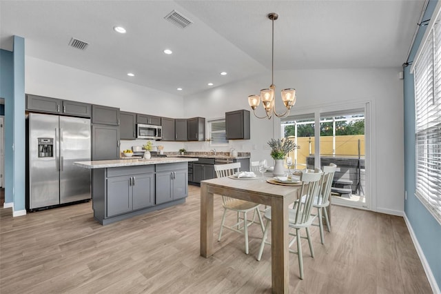 1397 Gatlin Pl, The Villages, FL 32163 - kitchen featuring visible vents, light wood finished floors, appliances with stainless steel finishes, and gray cabinetry