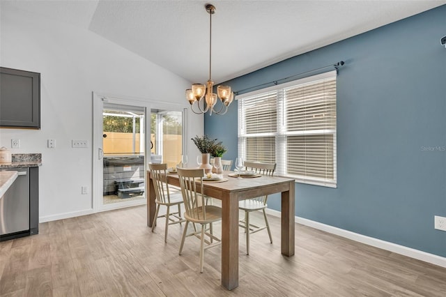 1397 Gatlin Pl, The Villages, FL 32163 - dining space with baseboards, light wood finished floors, a chandelier, and vaulted ceiling