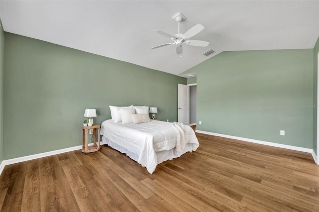 1397 Gatlin Pl, The Villages, FL 32163 - bedroom featuring visible vents, baseboards, lofted ceiling, and wood finished floors