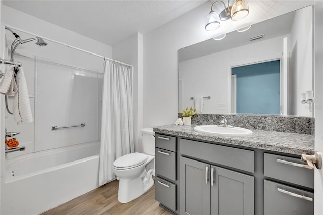 1397 Gatlin Pl, The Villages, FL 32163 - bathroom featuring visible vents, vanity, wood finished floors, toilet, and shower / bath combo