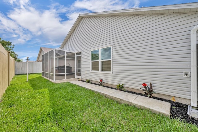 1397 Gatlin Pl, The Villages, FL 32163 - rear view of property featuring a fenced backyard, a yard, and a sunroom