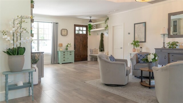 interior space featuring ornamental molding and wood finished floors