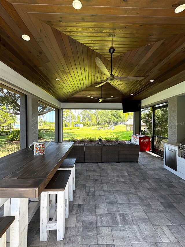 view of patio featuring outdoor dry bar, a ceiling fan, and outdoor lounge area