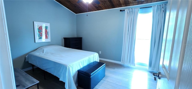 bedroom with wooden ceiling, baseboards, wood finished floors, and lofted ceiling