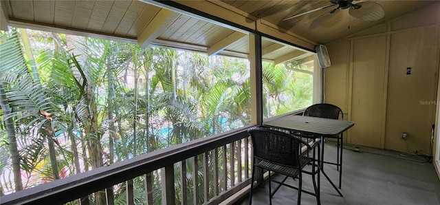 sunroom featuring ceiling fan