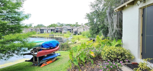 exterior space with a water view and a residential view
