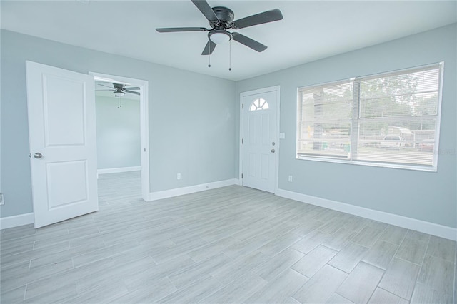 2501 Stratford Dr, Cocoa, FL 32926 - empty room featuring ceiling fan, baseboards, and light wood-style floors