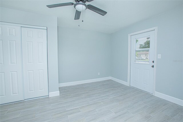 2501 Stratford Dr, Cocoa, FL 32926 - empty room with a ceiling fan, baseboards, and light wood-style flooring