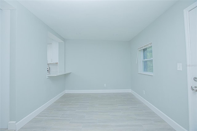 2501 Stratford Dr, Cocoa, FL 32926 - spare room with baseboards