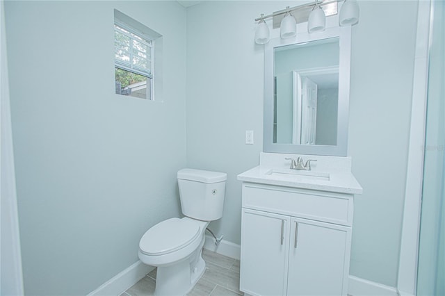 2501 Stratford Dr, Cocoa, FL 32926 - bathroom featuring baseboards, toilet, and vanity