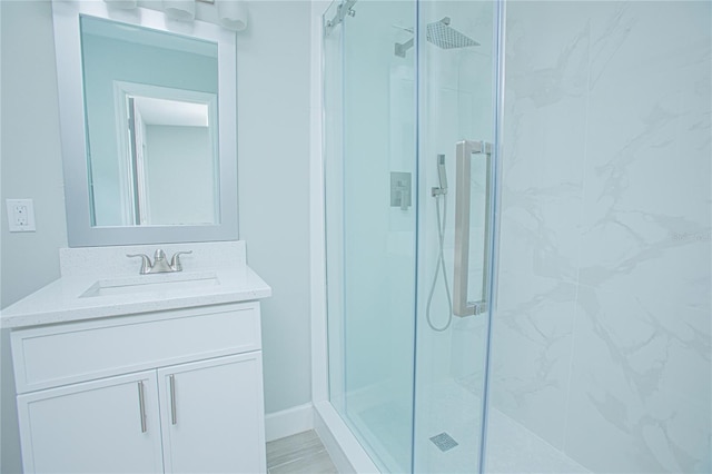 2501 Stratford Dr, Cocoa, FL 32926 - bathroom with a marble finish shower, vanity, and baseboards