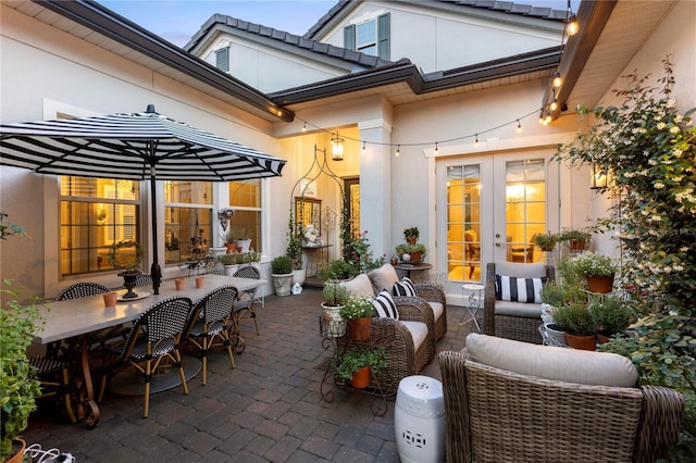 view of patio / terrace with french doors, outdoor dining space, and an outdoor hangout area