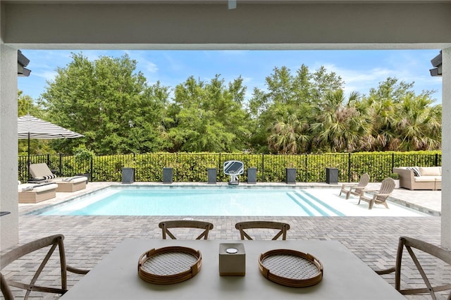 view of pool with a fenced in pool, a patio, and a fenced backyard
